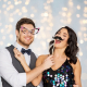 People in a photo booth at a wedding
