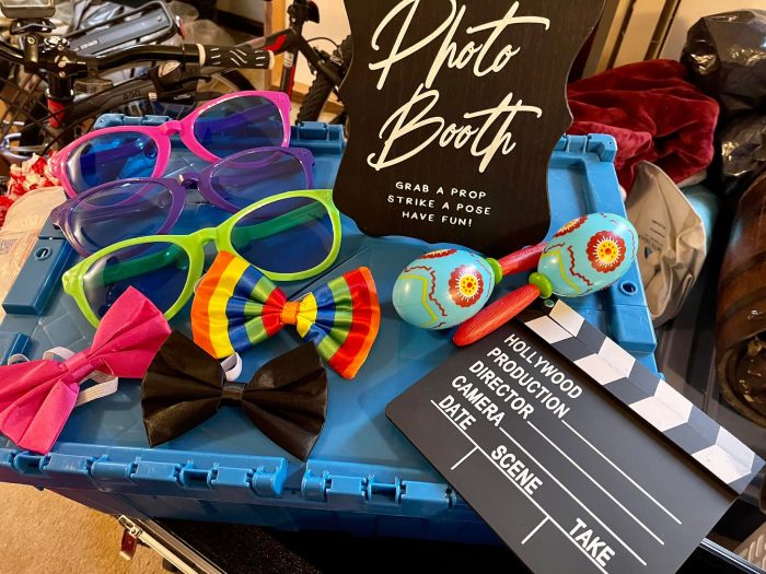 Example of photo booth props, including bow ties and large sunglasses